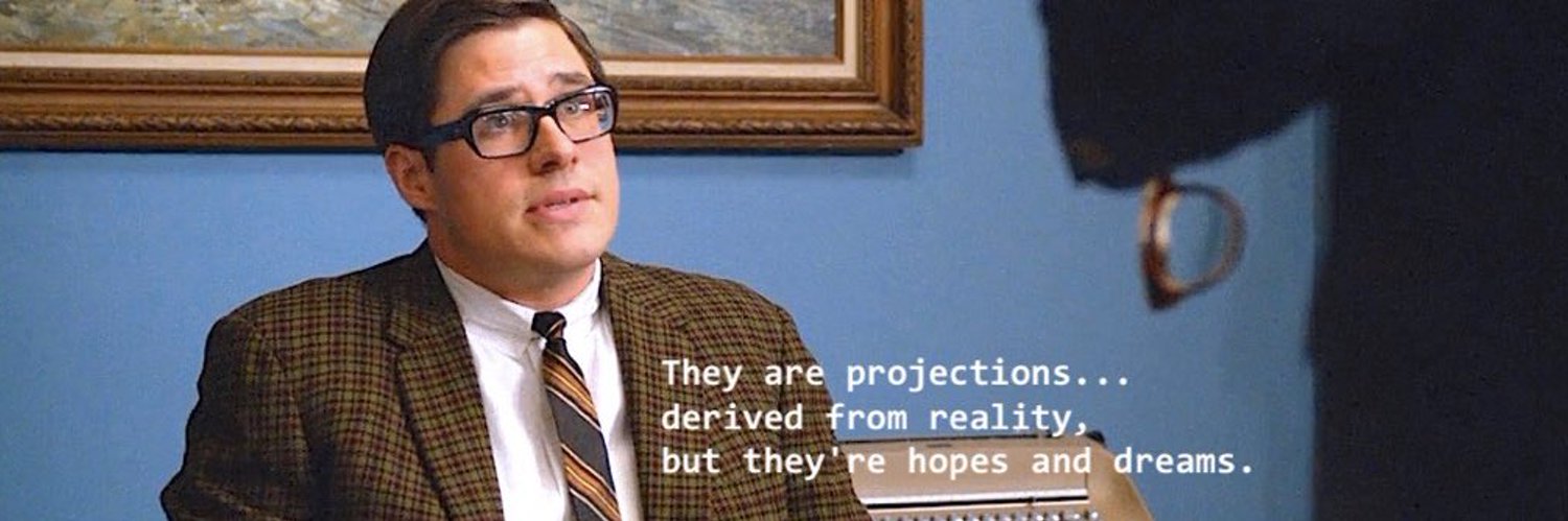 Ground projections, goals, and periodic reviews in governed metrics. A character explaining that projections are hopes and dreams derived from reality